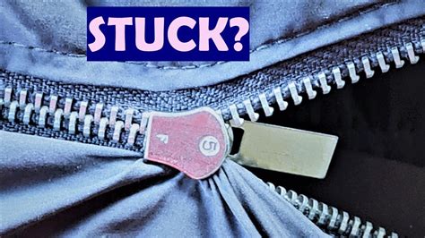 how to get fabric out of a metal zipper|u tube fabric stuck zipper.